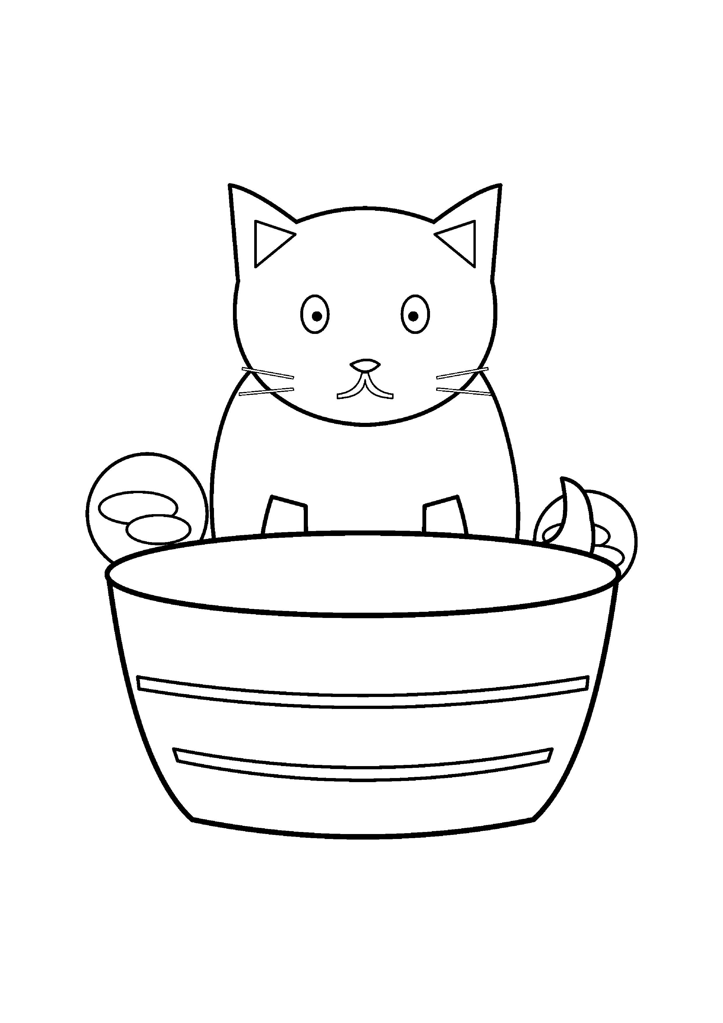 A small kitten peeks from a basket with two balls of yarn.