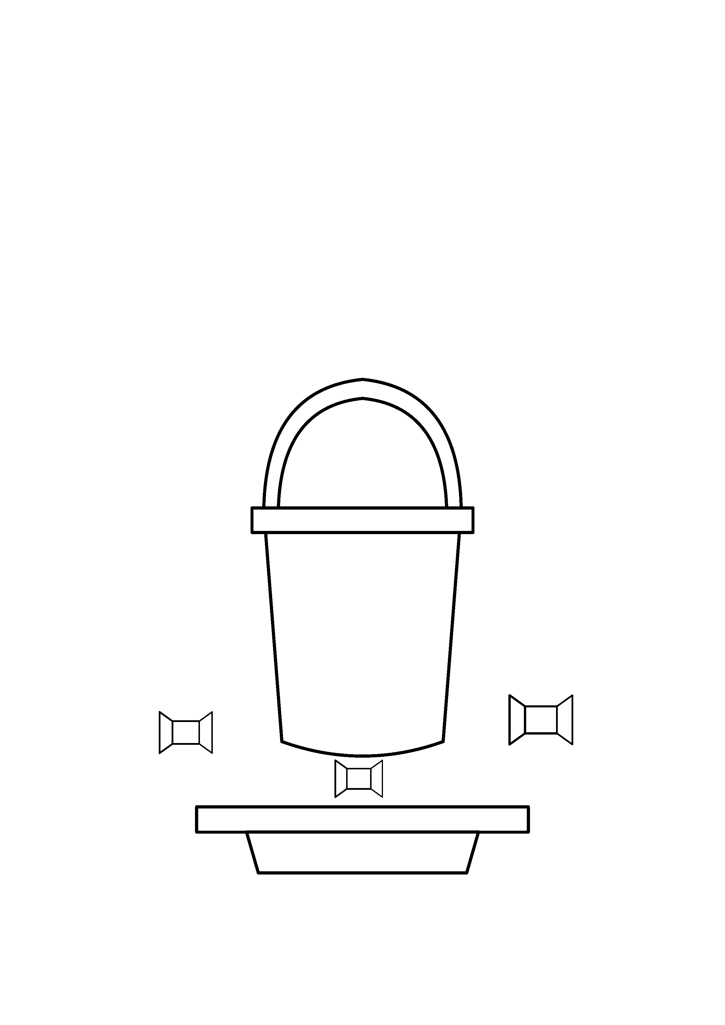 A candy bucket rests on stone steps with wrapped sweets around it.